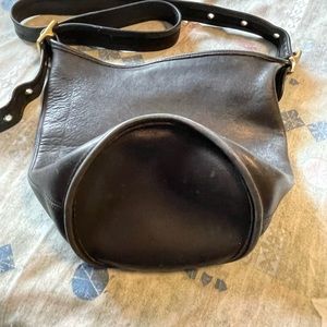 Black coach purse with cross body strap.Hobo bag